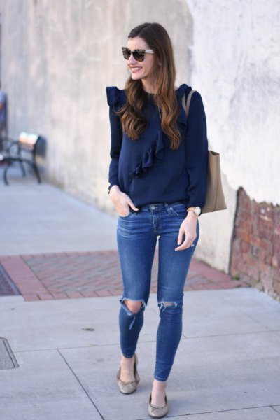 Dark blue long-sleeved top with blue ribbed skinny jeans