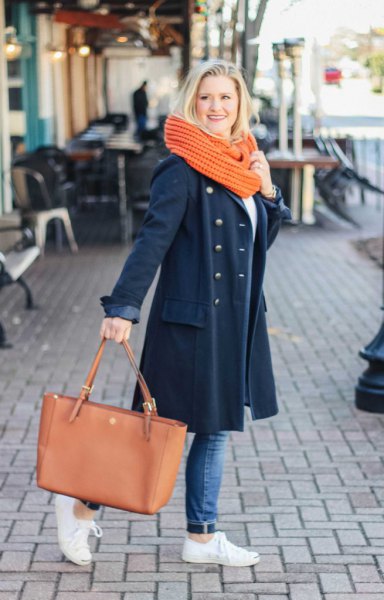 Dark blue wool coat with jeans and white sneakers