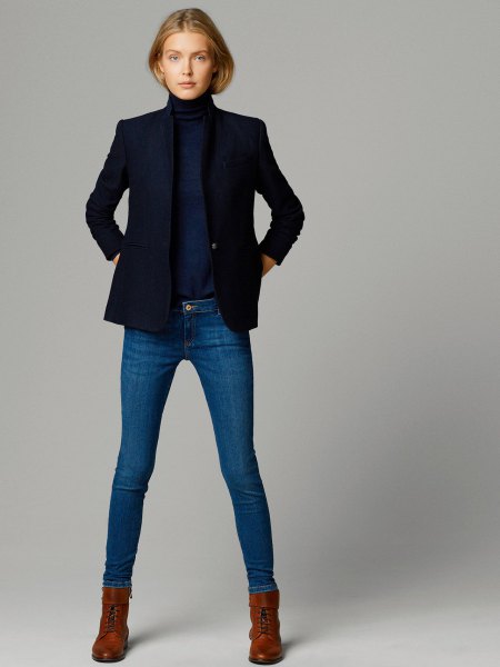 Dark blue sweater with a stand-up collar and matching jacket and skinny jeans