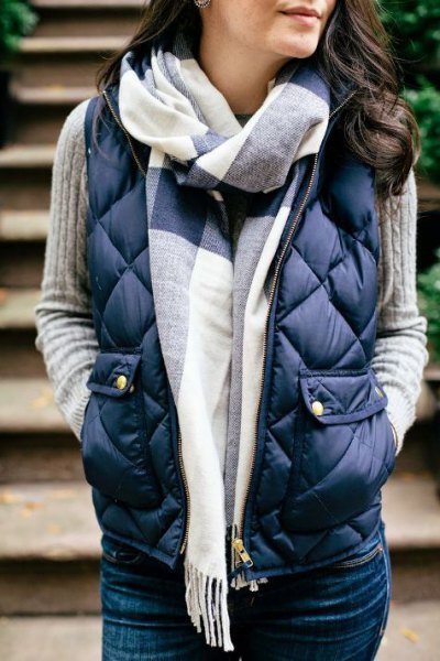 Dark blue quilted vest with gray ribbed sweater
