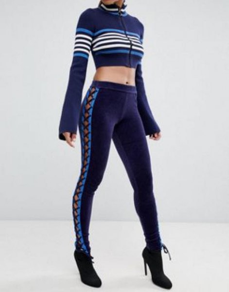 Dark blue running gaiters with matching, short-cut sweater with zip