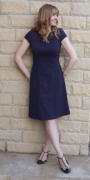 Dark blue, short-sleeved fit and knee-length dress with strappy flats