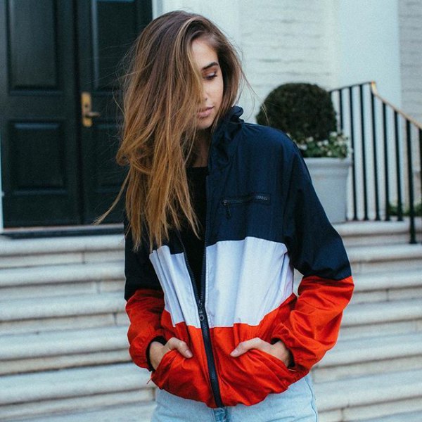 Navy blue white and red color block windbreaker with light blue boyfriend jeans