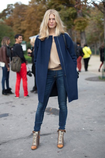 Long blue wool coat with a blushing pink sweater and super skinny jeans