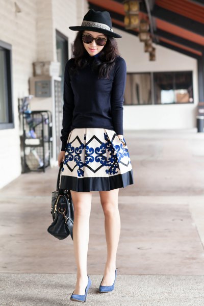Dark blue knitted sweater with a white and black printed skater skirt