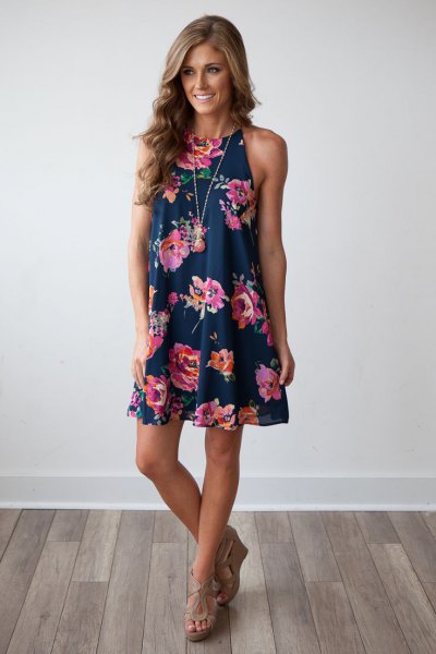 Dark blue mini swing dress with a floral pattern and nude heeled sandals