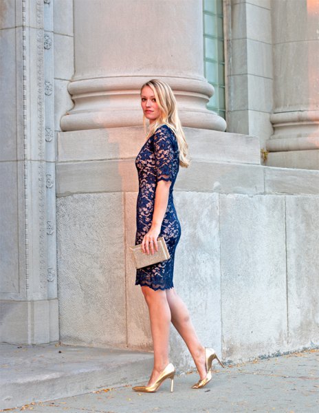 navy lace dress with pale pink clutch bag