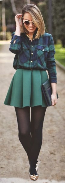 Navy plaid shirt with gray pleated skirt