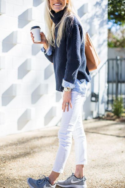 Navy sweater with a blue and white striped shirt with buttons