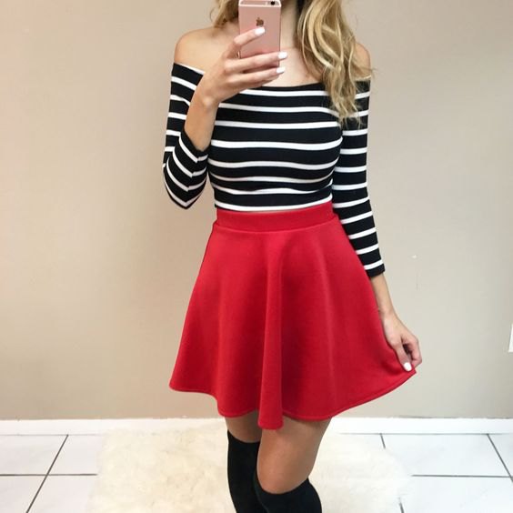 Strapless black and white striped long-sleeved shirt with a red skater skirt