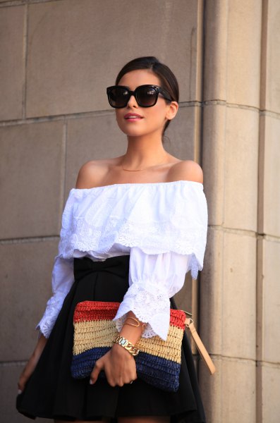 Off-the-shoulder blouse with a dark blue, flared miniskirt