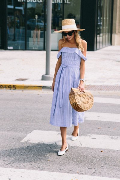 Off-shoulder fit and a flared midi dress with a straw hat