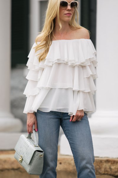 Off-the-shoulder, multi-layered ruffle chiffon blouse with blue jeans