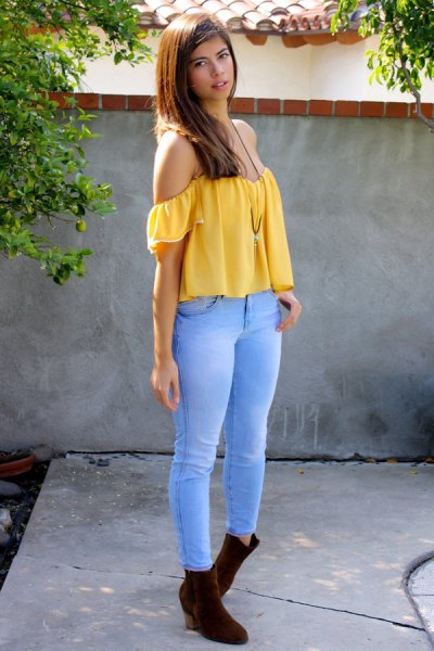 Off-the-shoulder yellow top with sky blue jeans