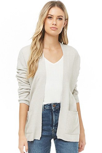 Cream-colored cardigan with a V-neck T-shirt and blue jeans