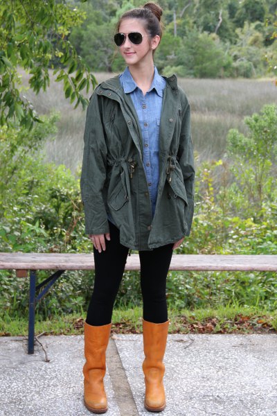 Olive green boyfriend jacket with a light blue chambray shirt with buttons and leather boots
