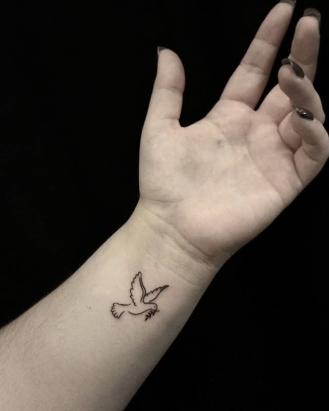 Olive branch and doves tattoo on wrist