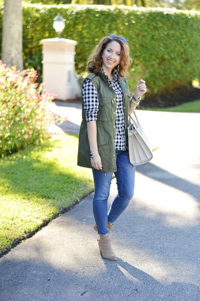 Olive green utility vest with a black and white checked boyfriend shirt