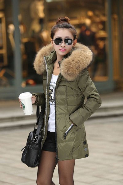 Hooded jacket made of olive-colored longline fur with white print and black mini-shorts