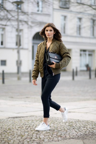 olive quilted bomber jacket with slim fit jeans with black cuffs