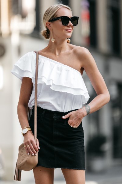 an off-the-shoulder black mini skirt with a frilled top