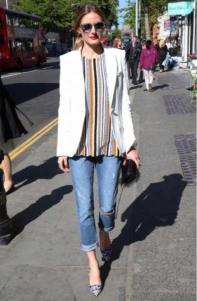 orange and black vertical striped blouse and jeans with cuffs