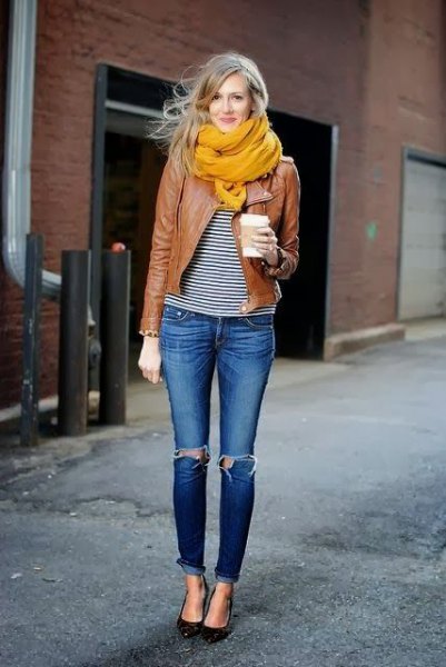 orange-colored chiffon scarf with a brown motorcycle jacket and black and white smart T-shirt