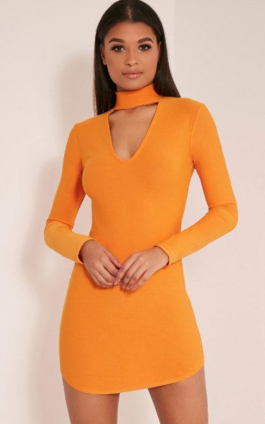 orange-colored, figure-hugging mini dress with choker neckline