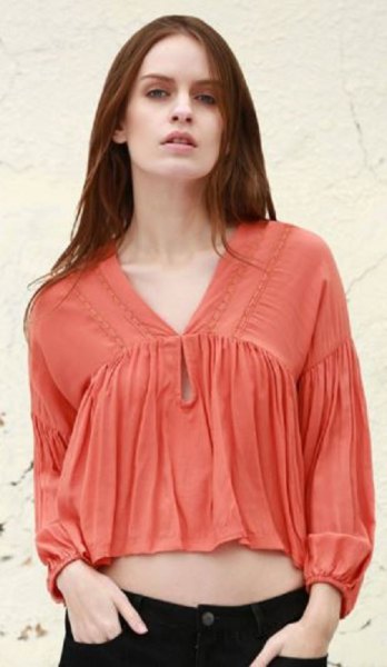 orange short cut blouse with puff sleeves and V-neck
