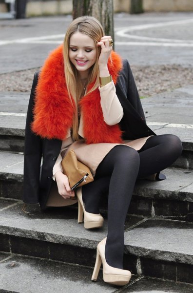 Orange faux fur scarf with a dark blue wool coat and skirt