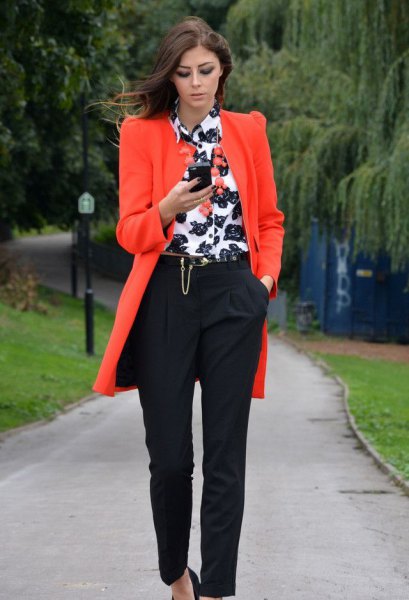 Orange long blazer with white and black printed shirt with buttons