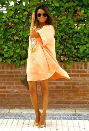 Orange mini sheath dress with wide sleeves and open bronze heels