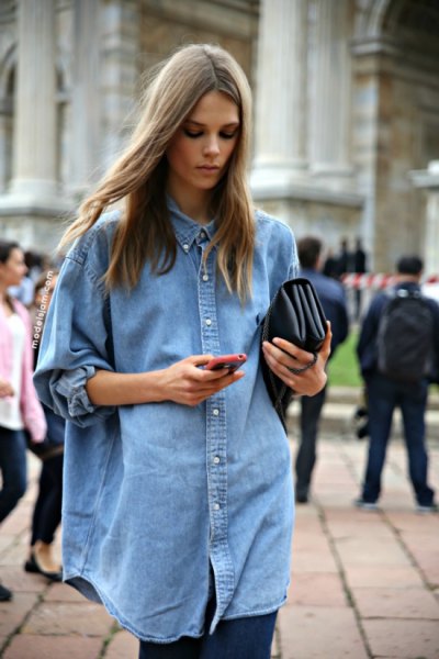Oversized light blue chambray shirt with buttons and black leggings