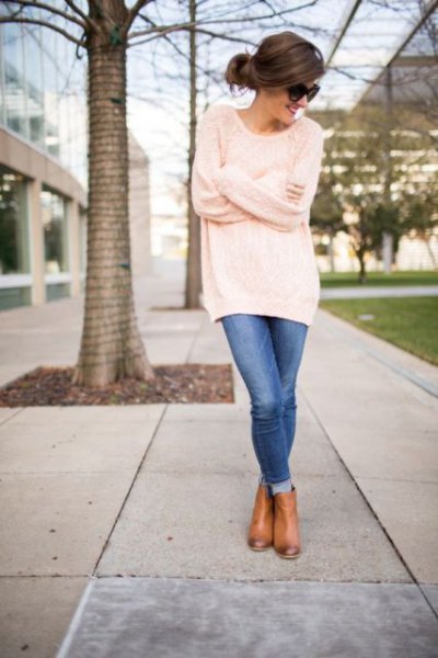 oversized tunic sweater with blue skinny jeans and leather boots