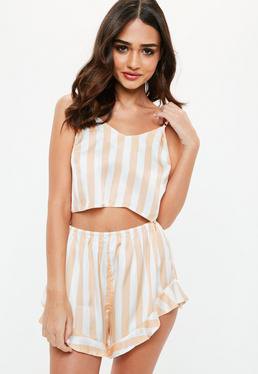 Light pink and white vertically striped flowing silk pajama shorts with a matching crop top