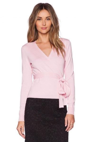 Light pink ballet wrap sweater with belt, black lace skirt