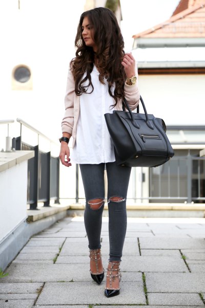 Light pink bomber jacket with a white shirt and black kitten heels