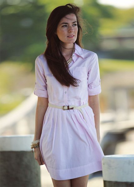 pale pink mini dress with button closure and silver statement chain