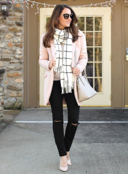 Light pink cardigan with a white and black checked fringed scarf