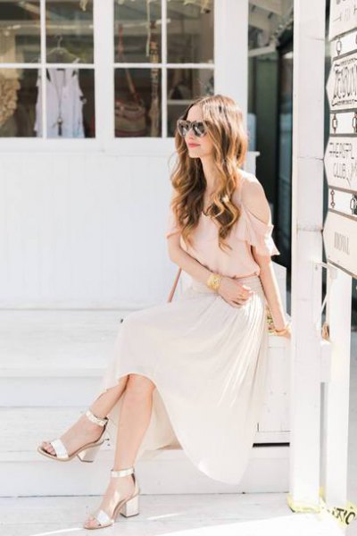 Light pink chiffon blouse with maxi white pleated skirt and golden open toe heels