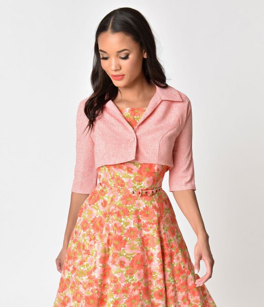 Light pink short-cut short-sleeved jacket with a red, floral printed midi dress