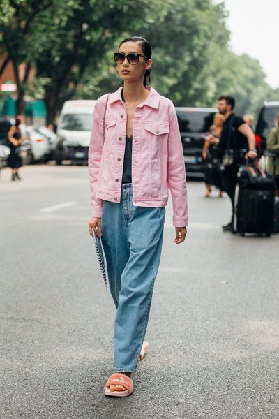 Light pink denim jacket with a black tank top with a deep V-neckline and wide-leg jeans