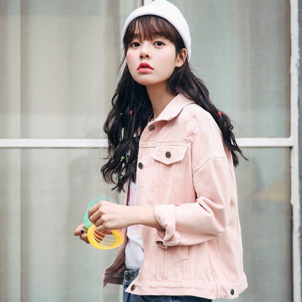 Light pink denim jacket with blue jeans and white knitted hat