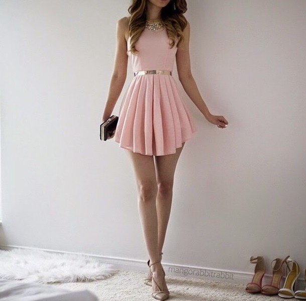 Light pink fit and flared, pleated mini dress with black and silver clutch handbag