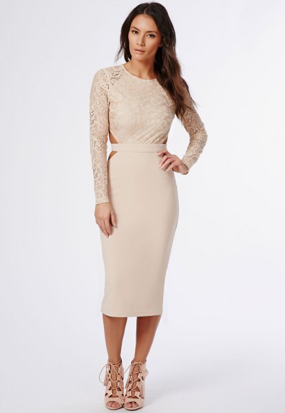 Light pink, figure-hugging midi dress with lace sleeves and open toe heels