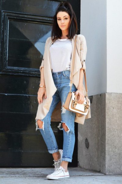 Light pink longline cardigan with blue ripped high-rise boyfriend jeans