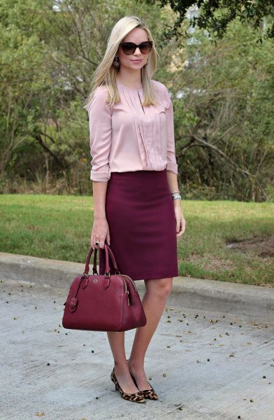Light pink pleated blouse with a burgundy skirt and heels with a leopard print
