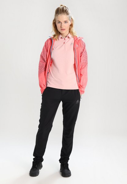 Light pink polo shirt with a blushing windbreaker and jogger pants