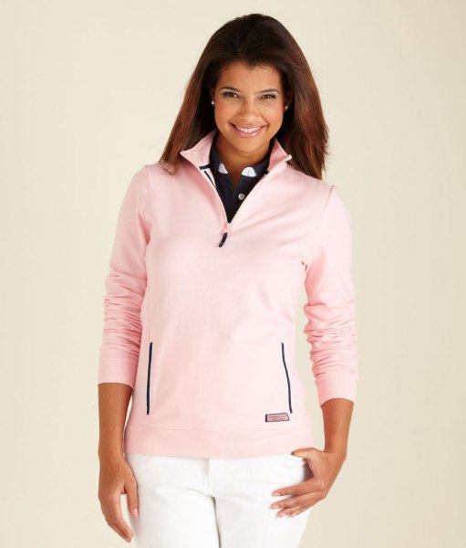 Light pink golf sweater with quarter zip and white jeans