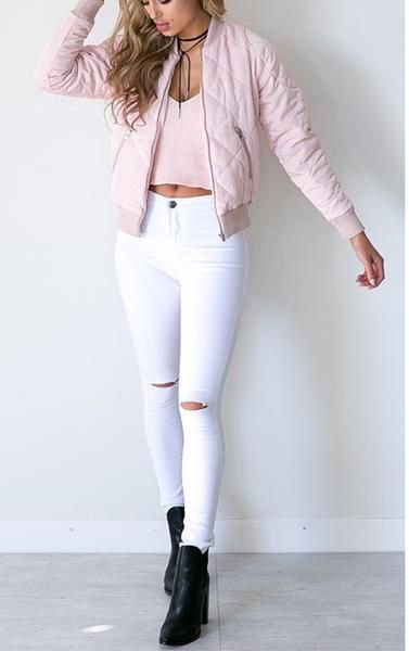 Light pink quilted bomber jacket with white high-waisted skinny jeans